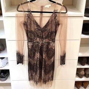Lace dress with sleeve details and attached nude slip